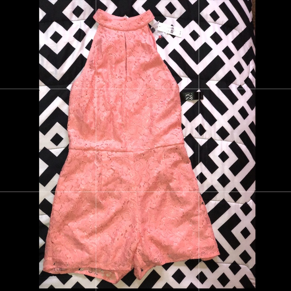 This is a coral pink New York & Company romper!